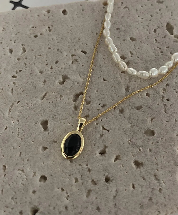 Zwarte onyx en parel stapelketting