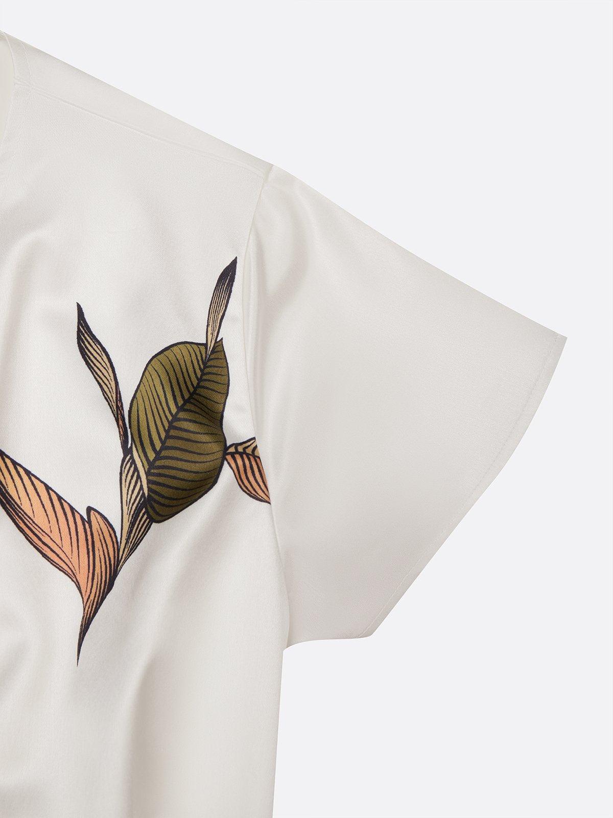Ama | Wikkeljurk met bladprint en strikceintuur