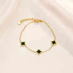 Vergulde armband met groene klaver