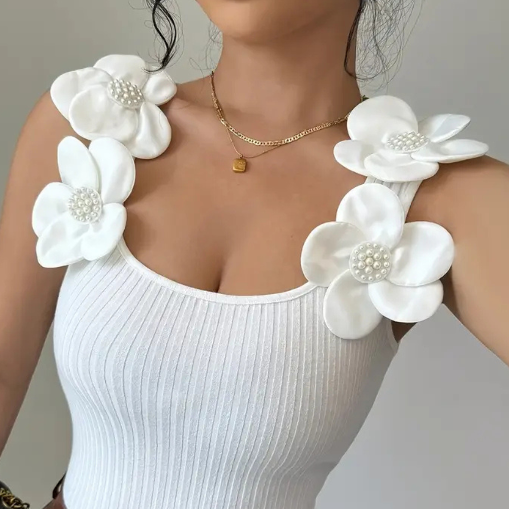 Witte mouwloze dames top met bloemdetails