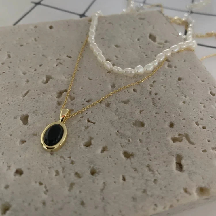 Zwarte onyx en parel stapelketting