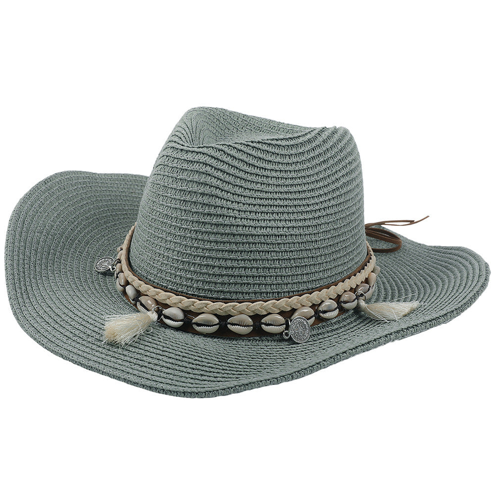 Lichte zomerhoed met schelpen en kwastjes