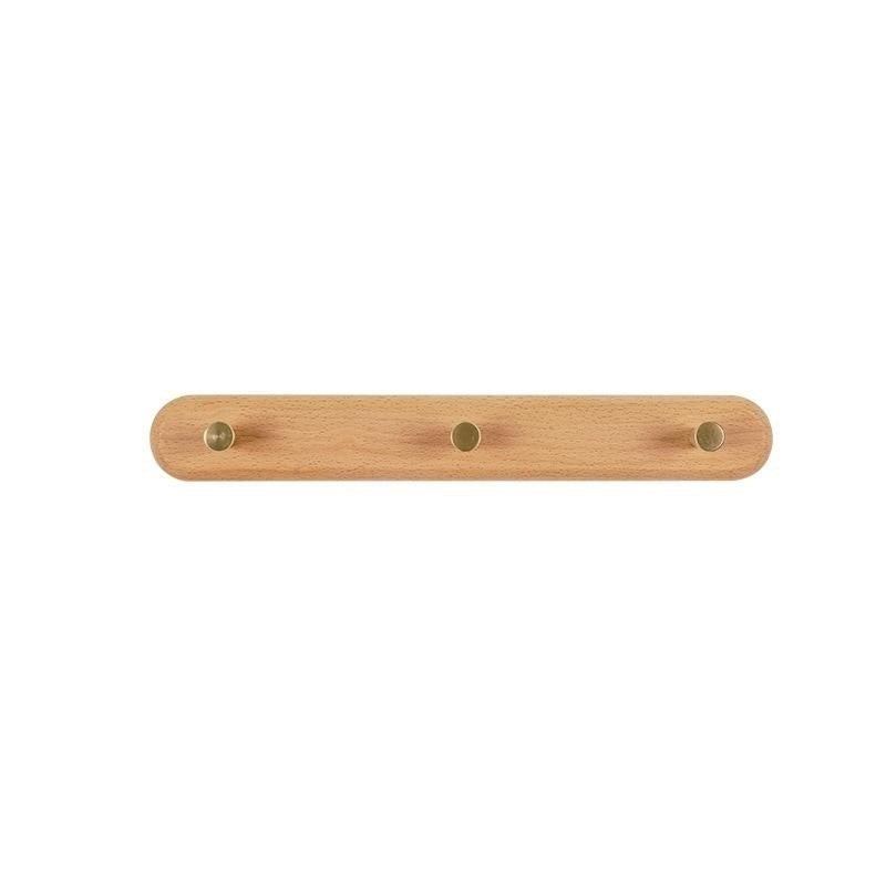 Wandkapstok van hout met messing haken