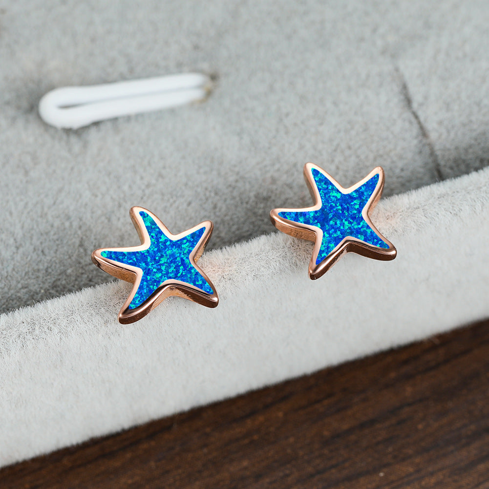 Blauwe opaal zeester oorbellen