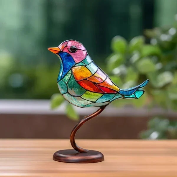 Decoratieve vogelbeeldjes met gekleurde afwerking