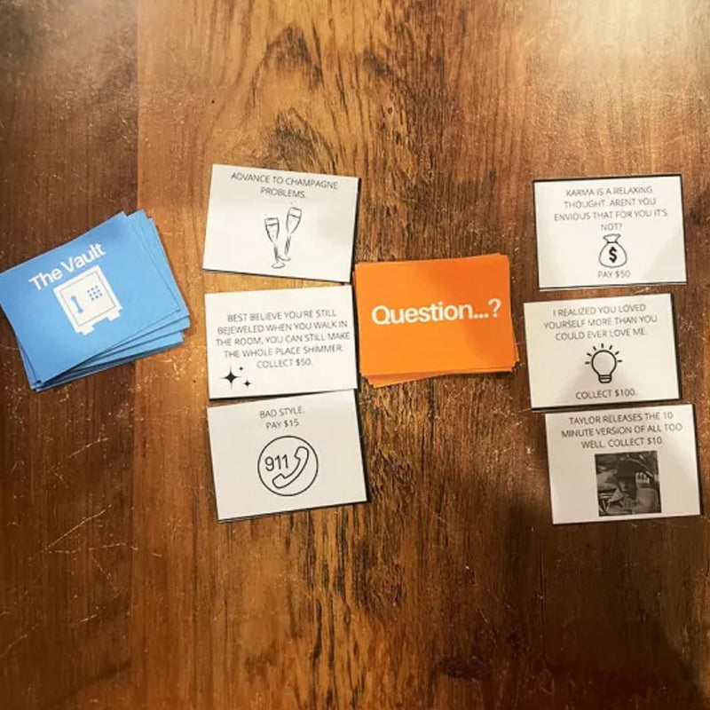 Muziekgebaseerd bordspel met songkaarten en monopoly-geld voor spelavonden