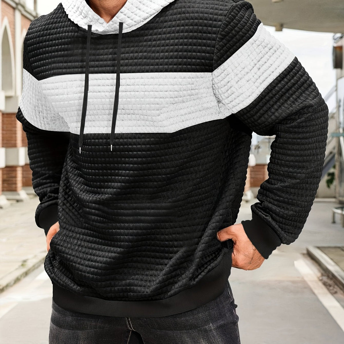 Tweekleurige hoodie met structuur en ribboorden