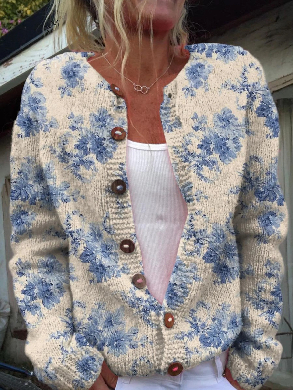 Gebreid vest met botanische bloemenprint en knopen in schildpadtint