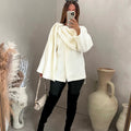 Bouclé poncho met sjaaldetail
