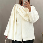 Bouclé poncho met sjaaldetail
