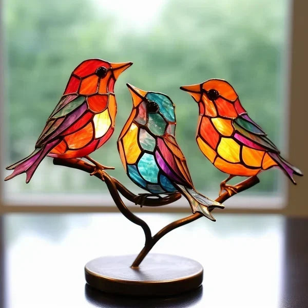 Decoratieve vogelbeeldjes met gekleurde afwerking