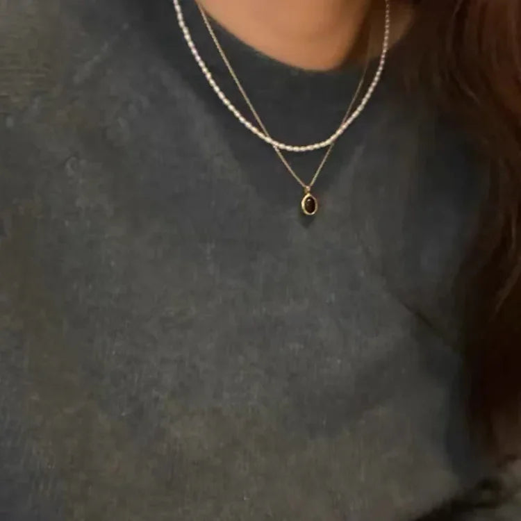 Zwarte onyx en parel stapelketting