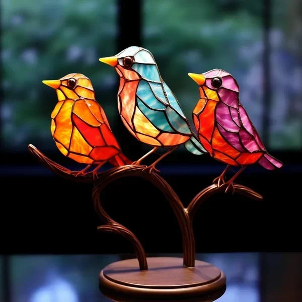 Decoratieve vogelbeeldjes met gekleurde afwerking