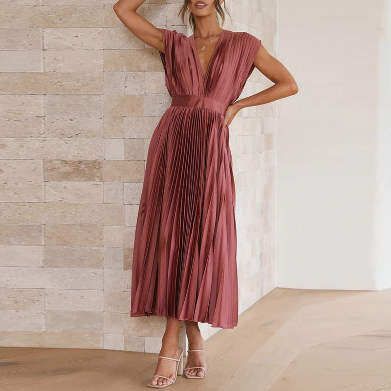 Vloeiende maxi jurk met plooien en V-hals
