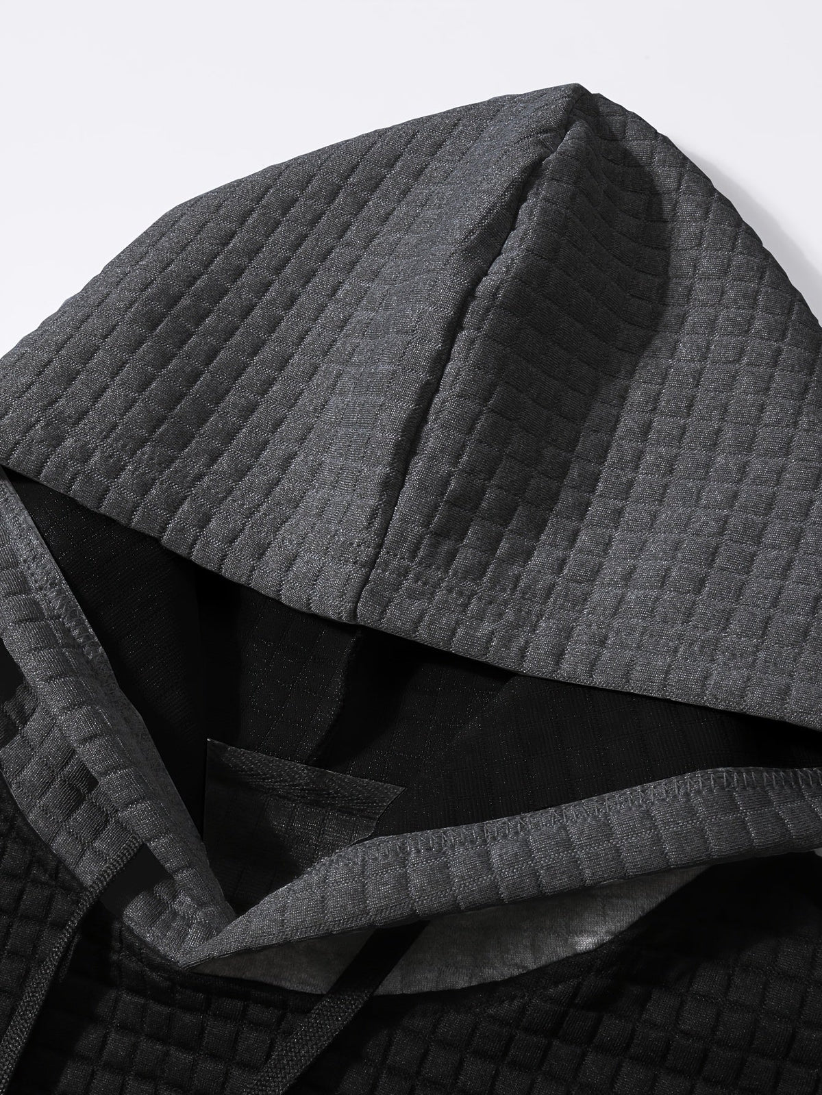 Tweekleurige hoodie met structuur en ribboorden