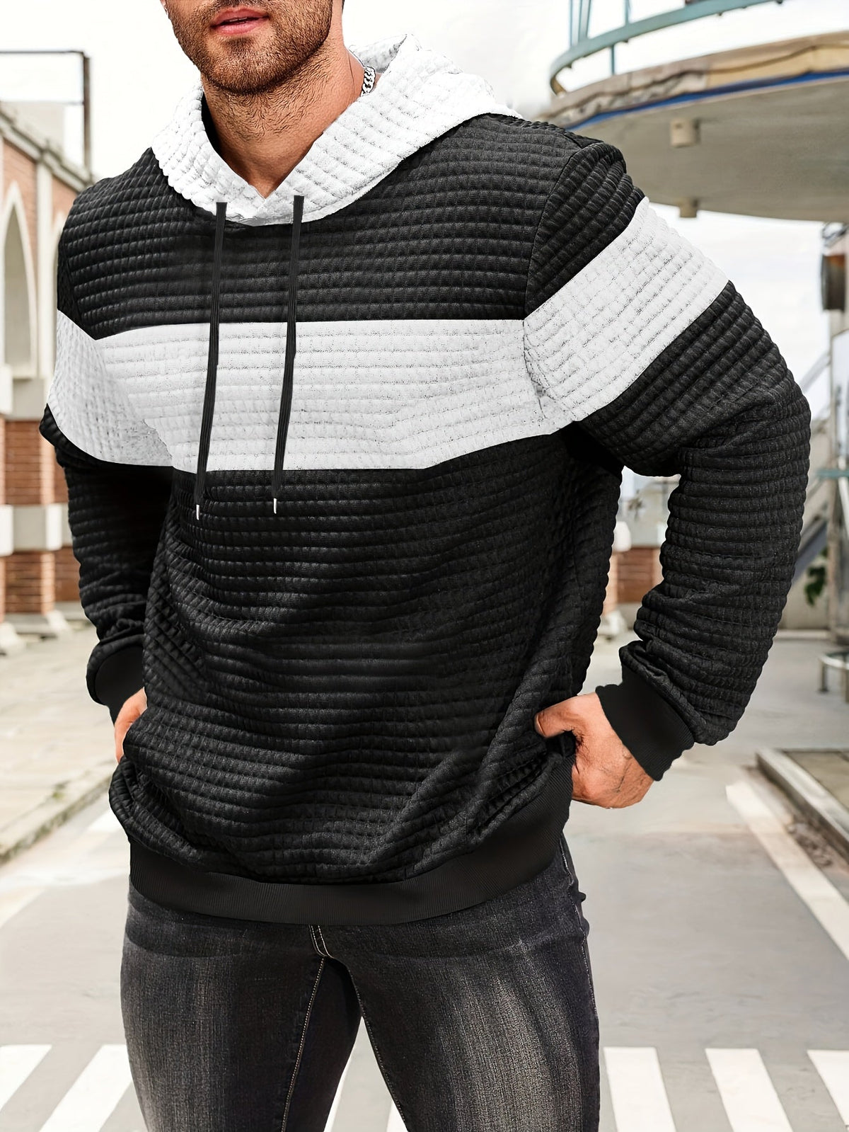 Tweekleurige hoodie met structuur en ribboorden