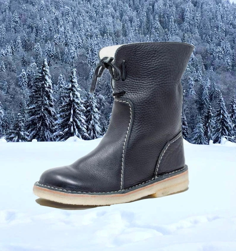 Damesboots van nubuckleer met wollen voering en vetersluiting