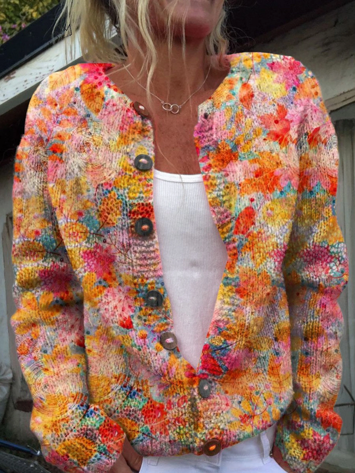 Gebreid vest met bloemenprint in warme tinten