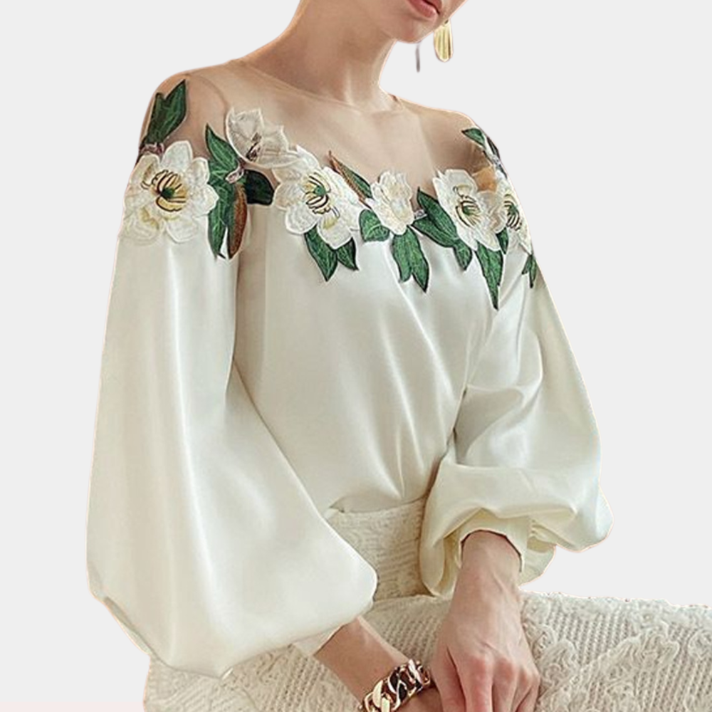 Gebloemde beige damesblouse met losse pasvorm