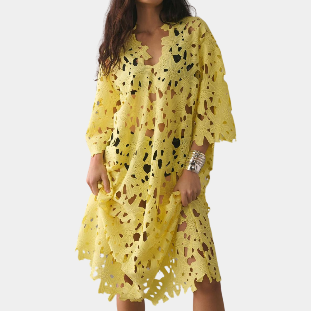 Zwierige midi jurk met geborduurde details