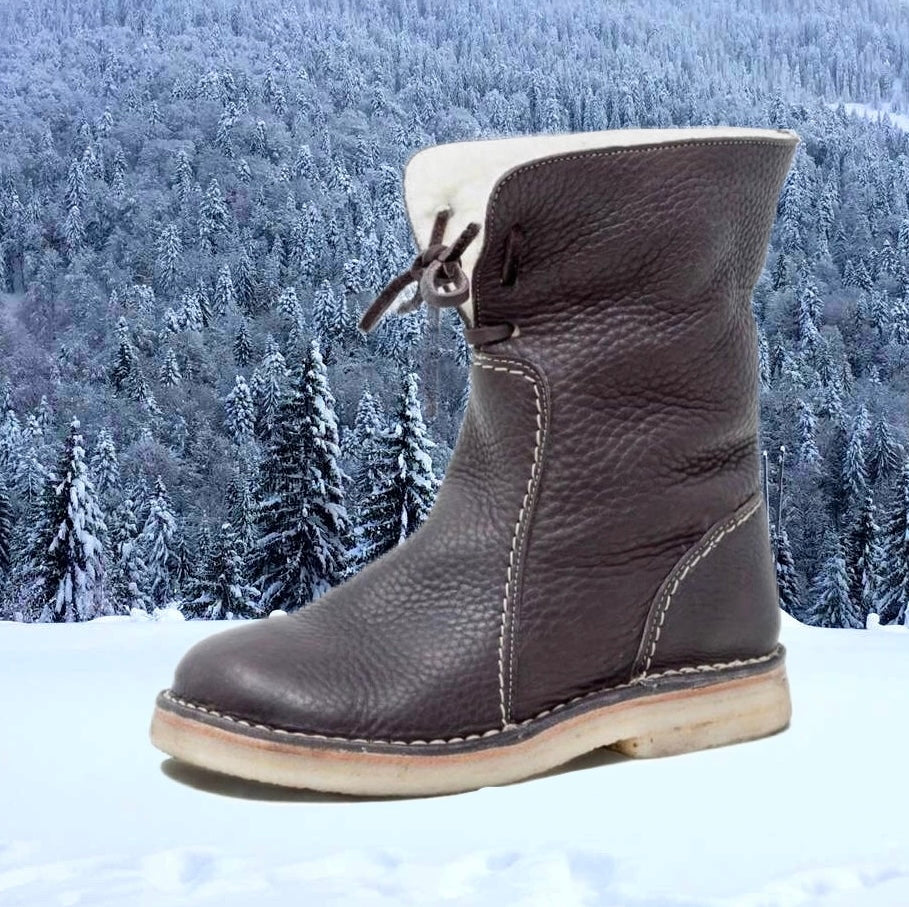 Damesboots van nubuckleer met wollen voering en vetersluiting