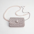 Glinsterende mini-tas met details