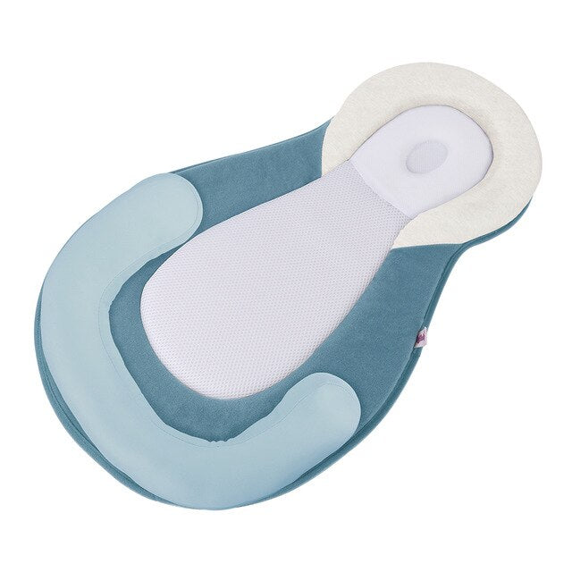 Ergonomisch draagbaar babybedje met hoofdsteun tegen afplatting van het hoofd