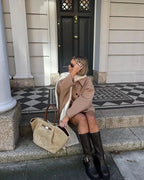 Dames tussenjas in oversized look met knoopsluiting