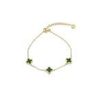 Vergulde armband met groene klaver