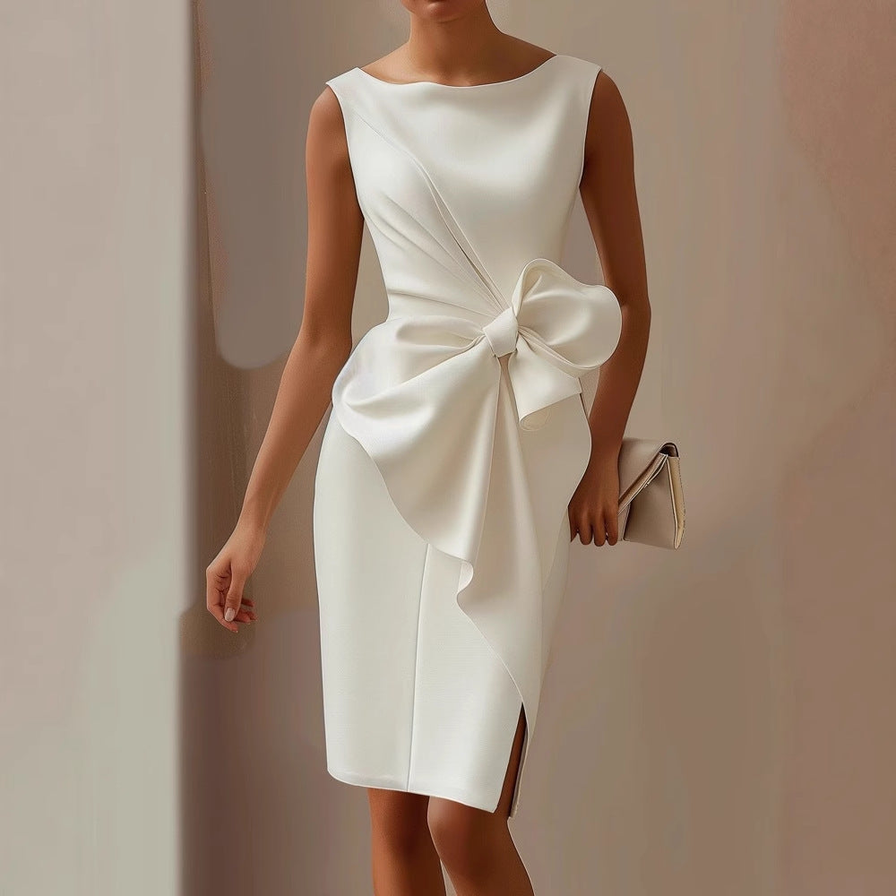 Filomena | Mouwloze jurk met grote strik en drapering
