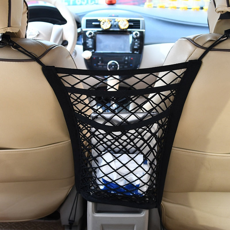 Elastisch opbergnet tussen autostoelen
