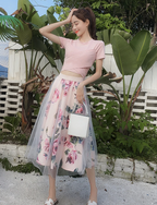 Outfit met mesh en bloemenmotief