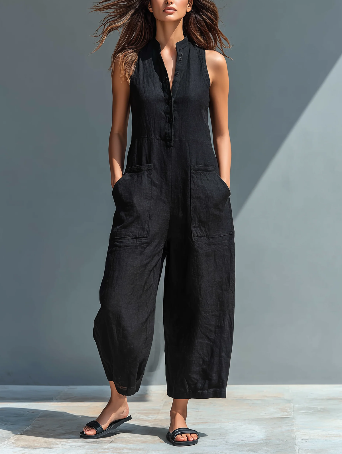 Mila | Mouwloze katoenen jumpsuit met wijde pijpen en knoopsluiting