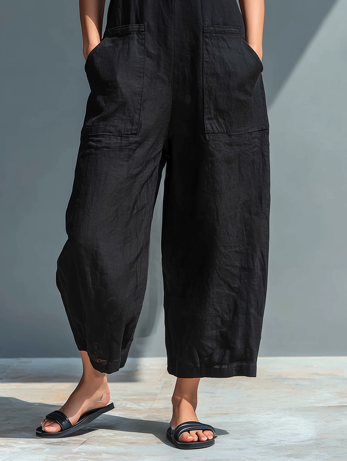 Mila | Mouwloze katoenen jumpsuit met wijde pijpen en knoopsluiting