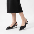 Zwarte slingbacks met spitse neus
