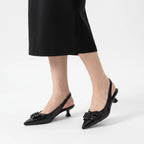 Zwarte slingbacks met spitse neus
