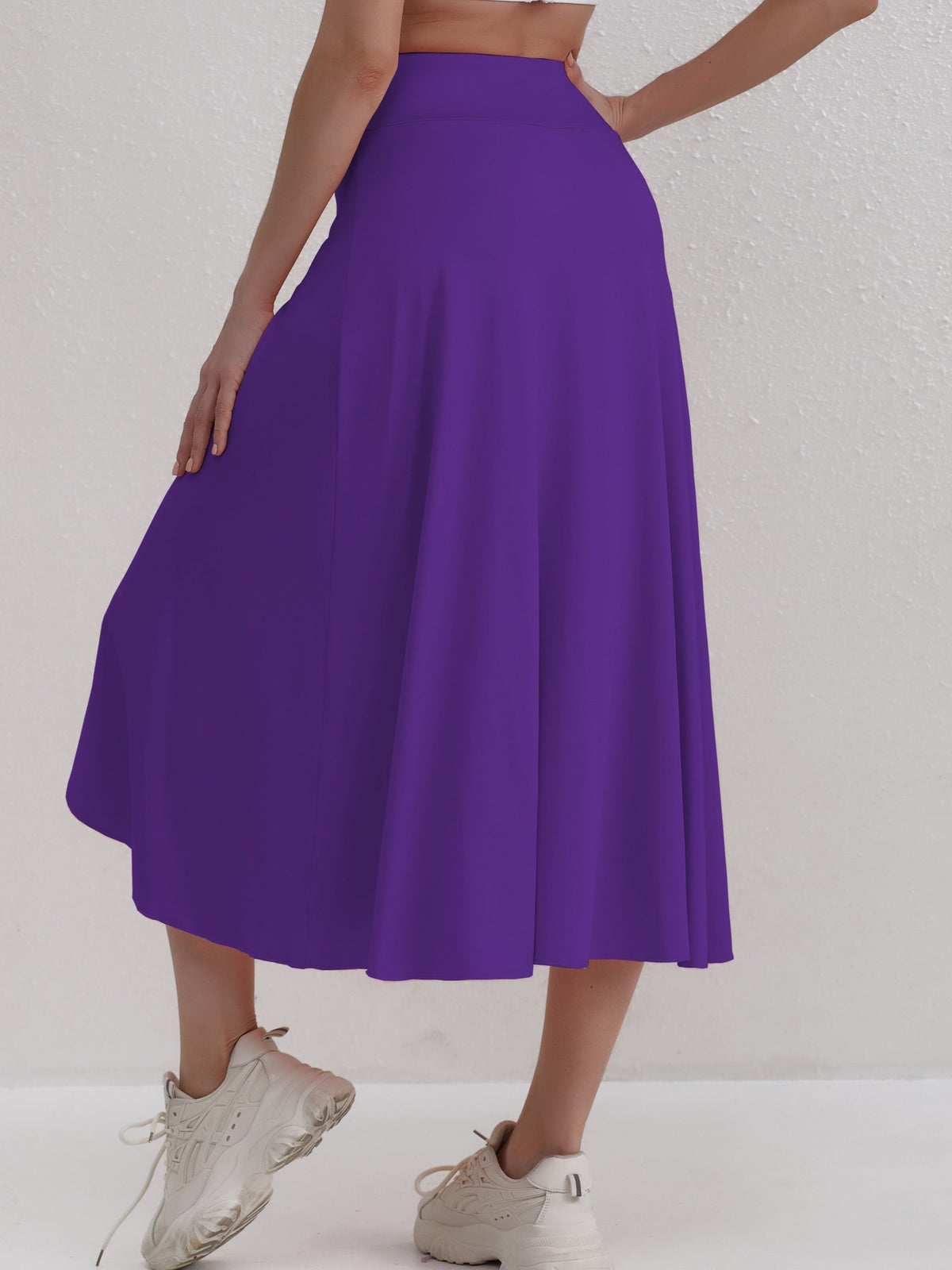 Sportieve rok met hoge taille en asymmetrische snit