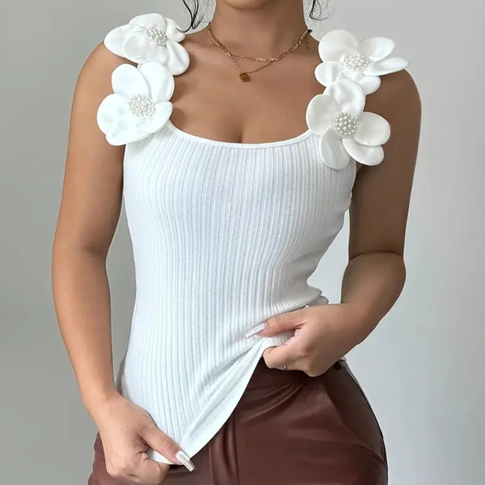 Witte mouwloze dames top met bloemdetails