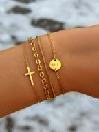 Kruisarmband in goud- en zilverkleur
