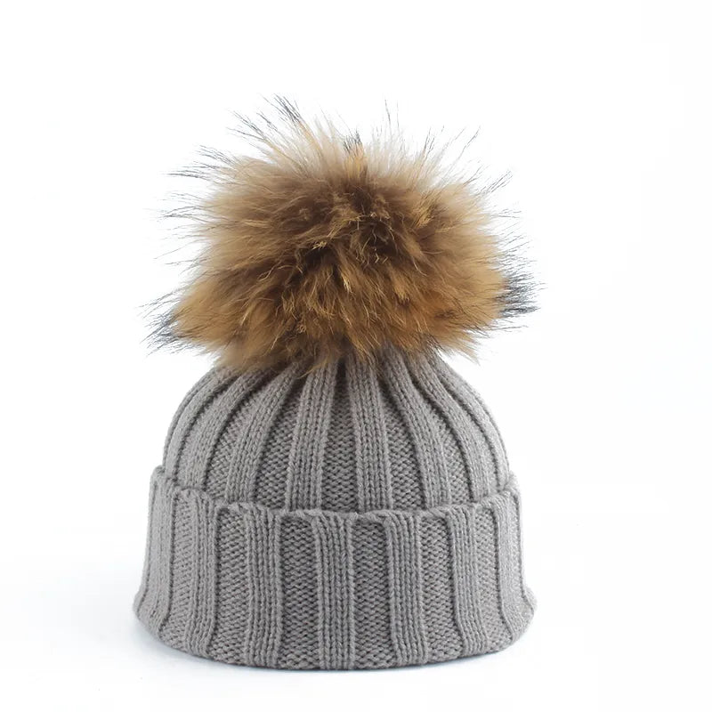 Gebreide winter pom-pom muts