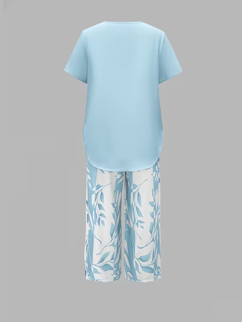 Tweedelige set met gelaagde top en bladprintbroek