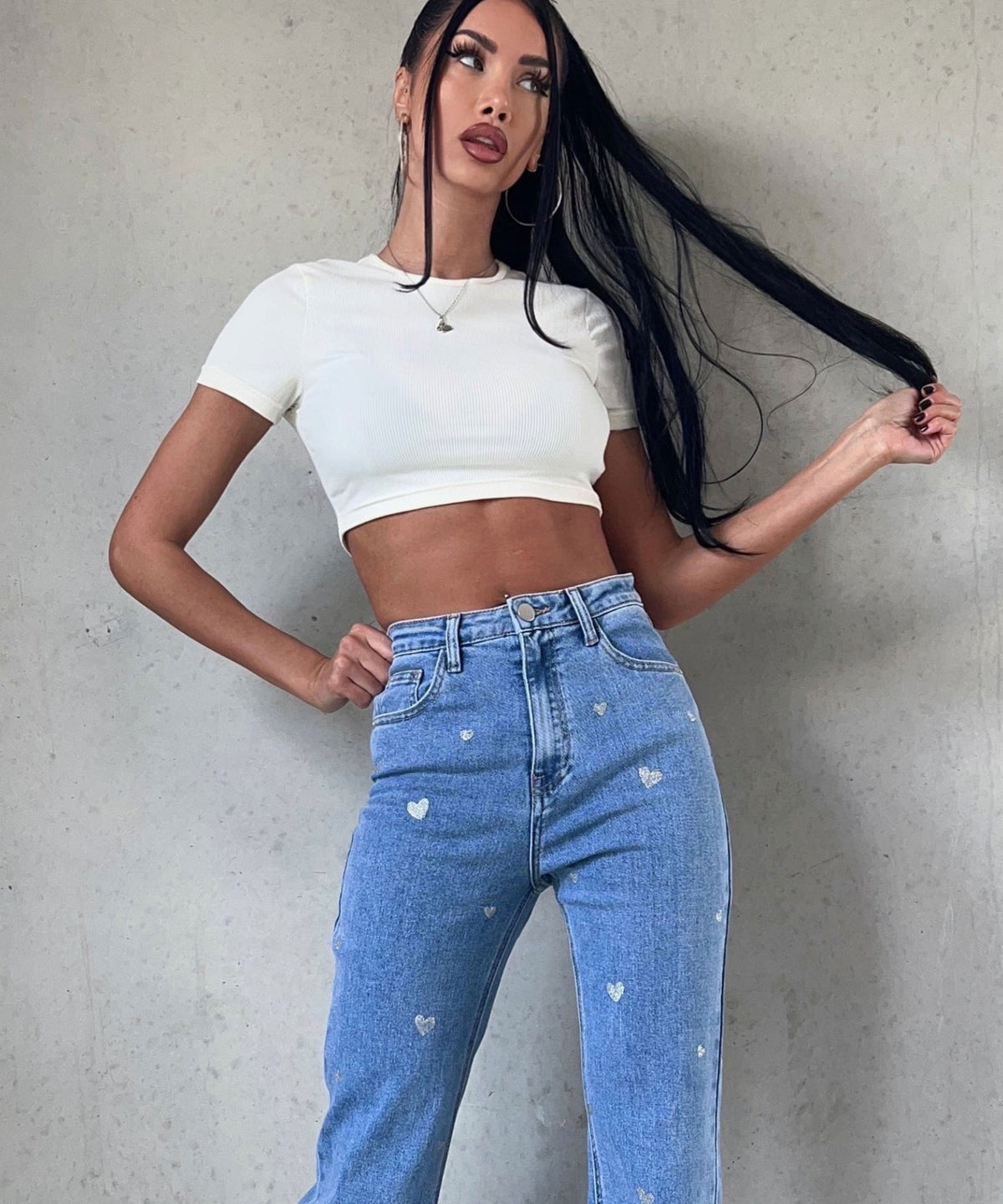 Dames stretch jeans met wijde pijpen en hartjesprint
