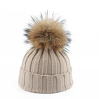 Gebreide winter pom-pom muts