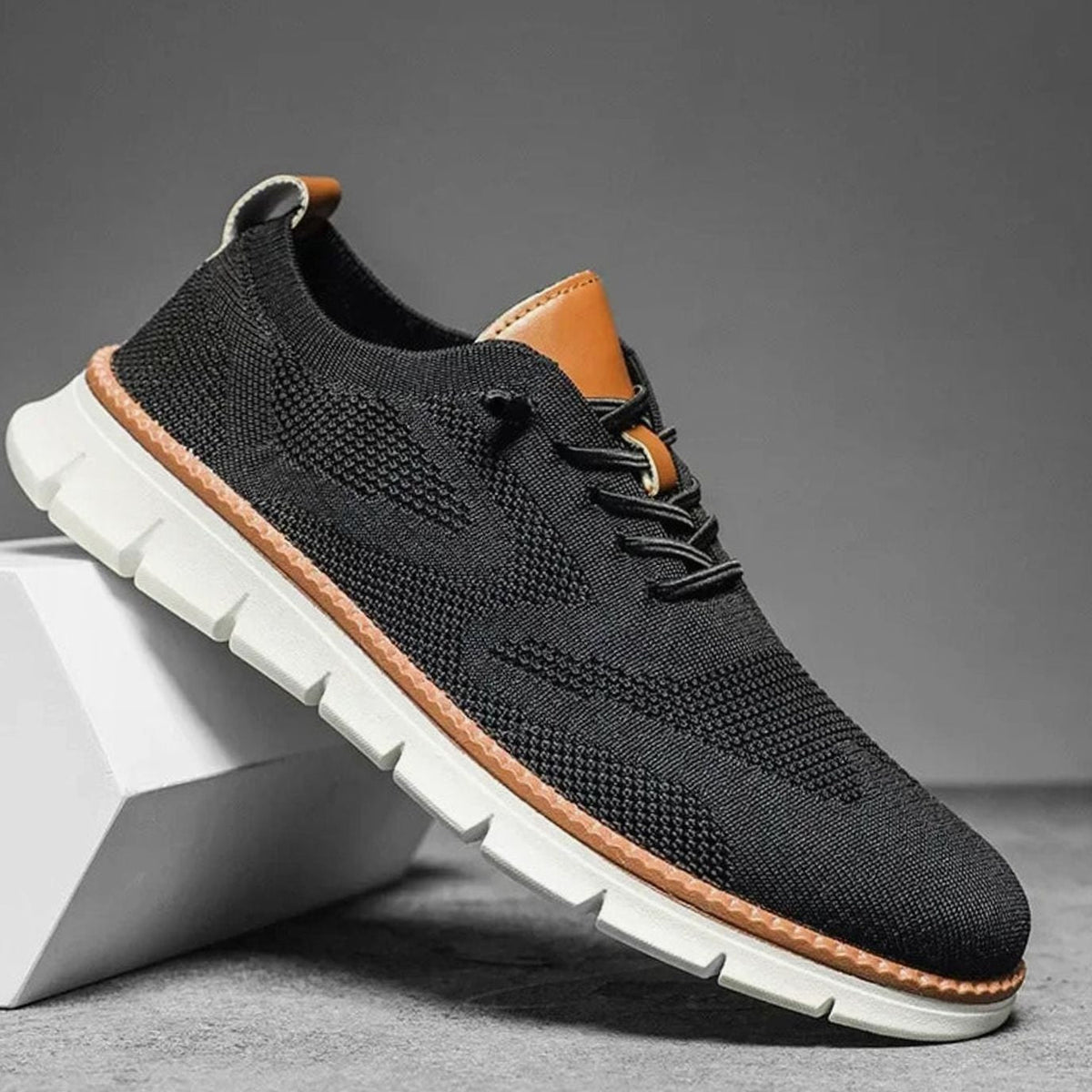 Gebreide herensneakers met leren hieltab