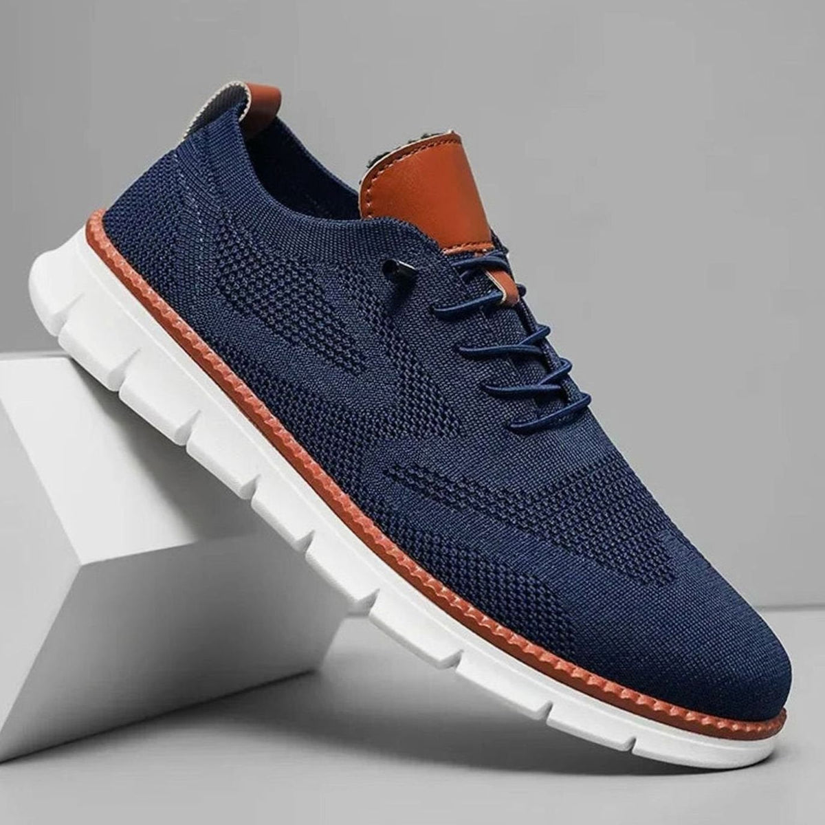 Gebreide herensneakers met leren hieltab