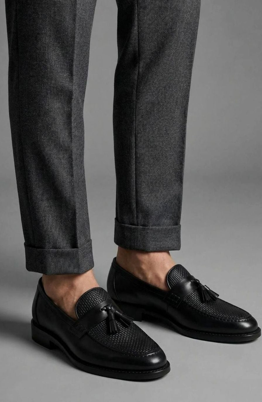 Leren instaploafers met gevlochten neus en kwastjes