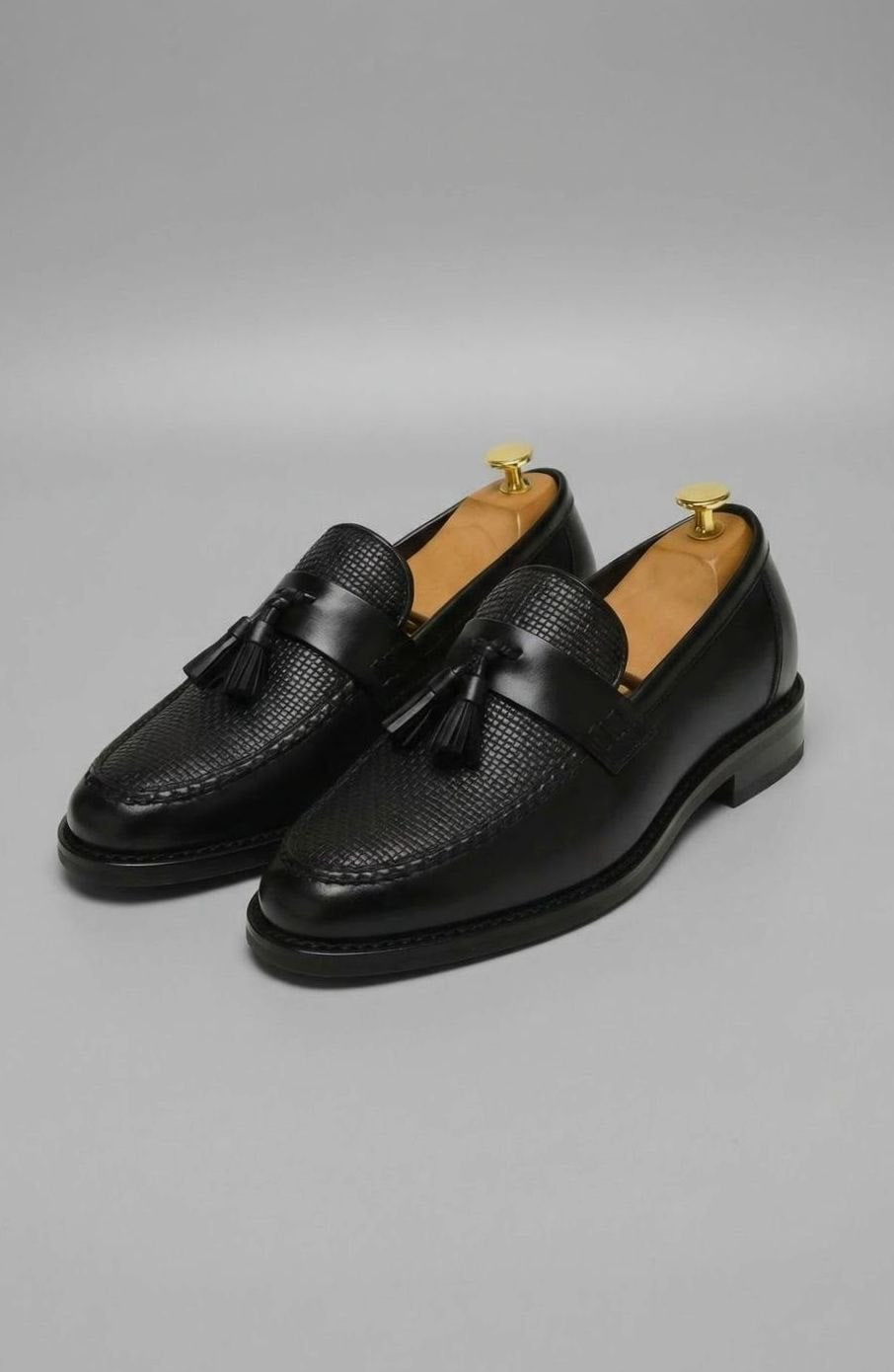 Leren herenloafers met geweven neus en kwastjes