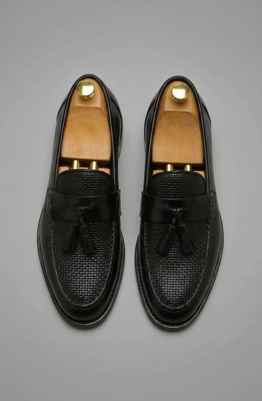 Leren herenloafers met geweven neus en kwastjes