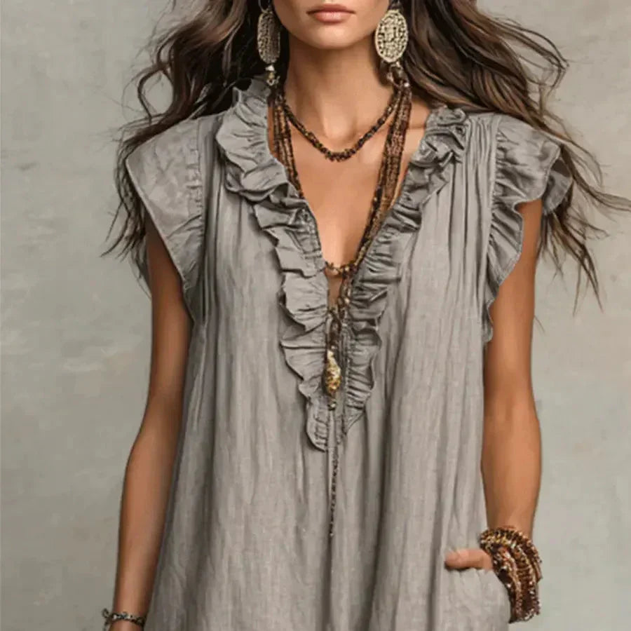Merel | Lange bohemian jurk met volantdetails en functionele zakken