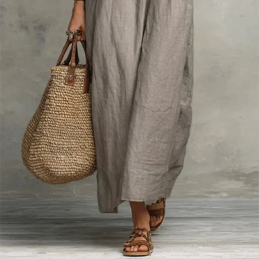 Merel | Lange bohemian jurk met volantdetails en functionele zakken